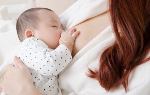 Woman feeding baby